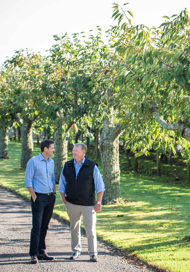 Dan and Bruce in an orchard